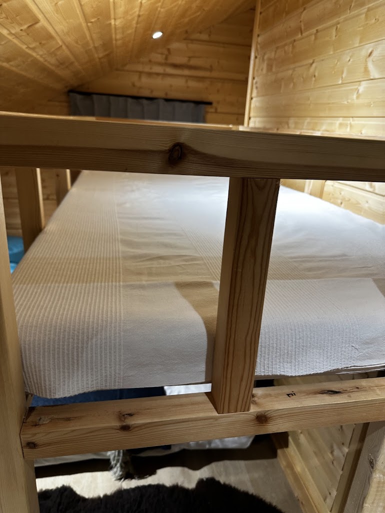 Children’s bunk beds inside the log cabin